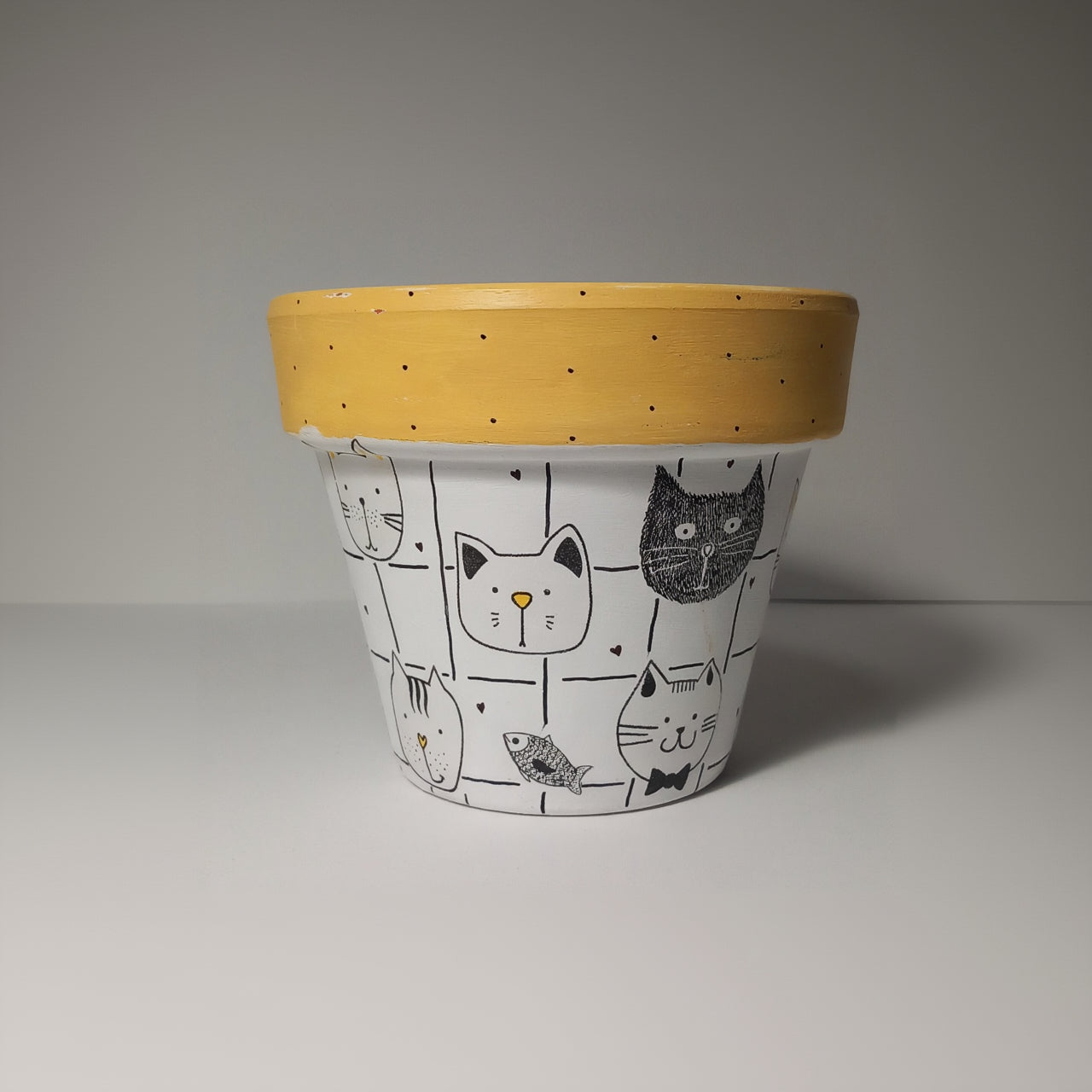 Maceta cabeza de gatos